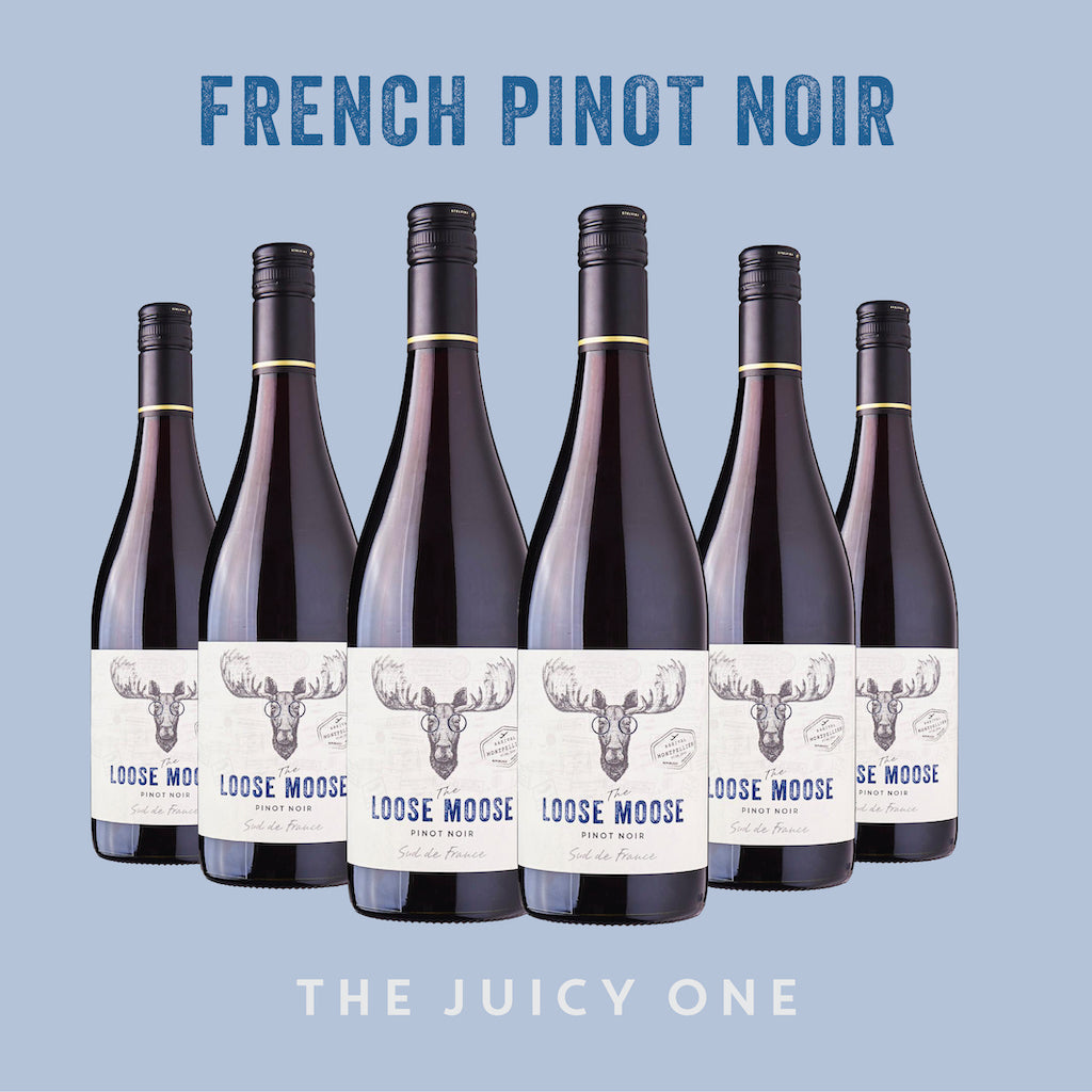 Six bottles of Sud de France Pinot Noir by Loose Moose with the text 'THE JUICY ONE' on the label, against a blue background.