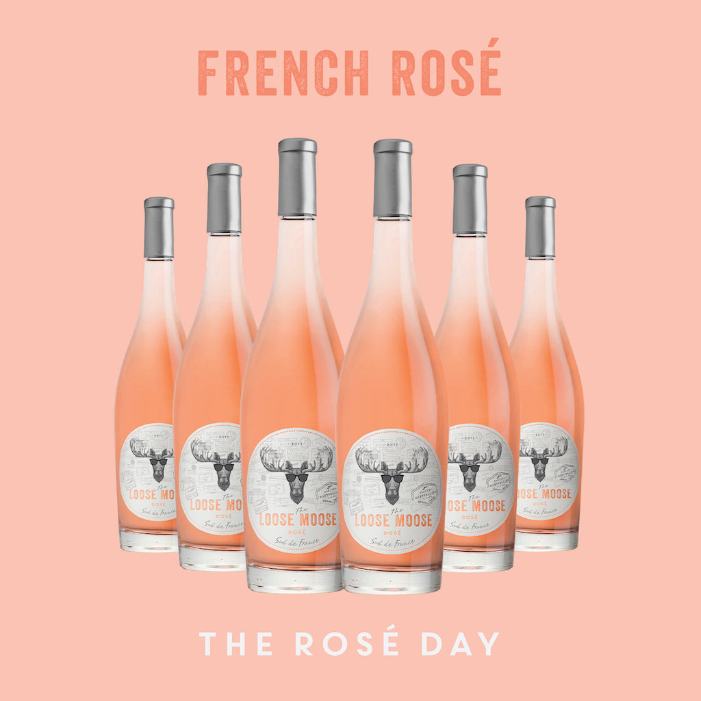Six bottles of Sud de France Rose Wine arranged neatly, with the text 'FRENCH ROSE' and 'THE ROSÉ DAY' displayed above and below the bottles respectively.