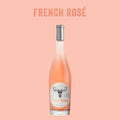Bottle of French Rosé wine with a label on a pink background