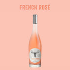 Bottle of French Rosé wine with a label on a pink background