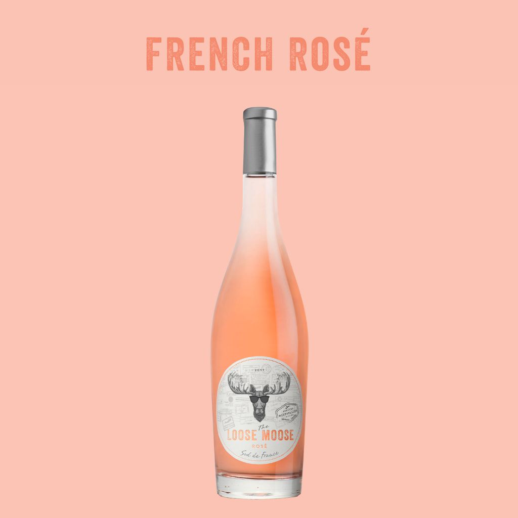 Bottle of French Rosé wine with a label on a pink background